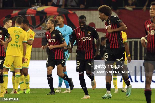 Nice's Ivorian forward Nicolas Pepe celebrates with teammates after scoring his team's first goal during the French L1 football match between OGC...