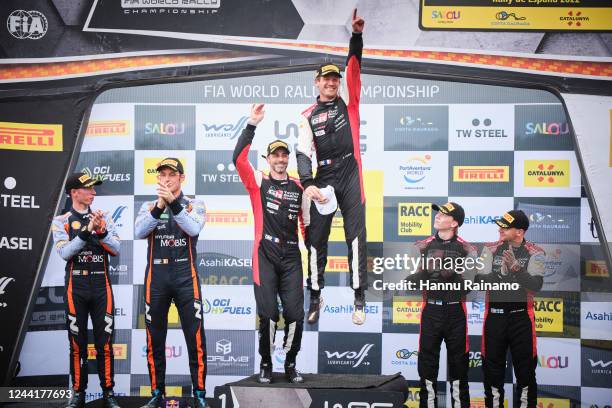 Race winners Sébastien Ogier and Benjamin Veillas of Toyota Gazoo Racing WRT celebrate on the power stage podium alongside second placed Thierry...