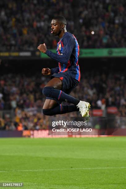 Barcelona's French forward Ousmane Dembele celebrates scoring his team's first goal during the Spanish league football match between FC Barcelona and...