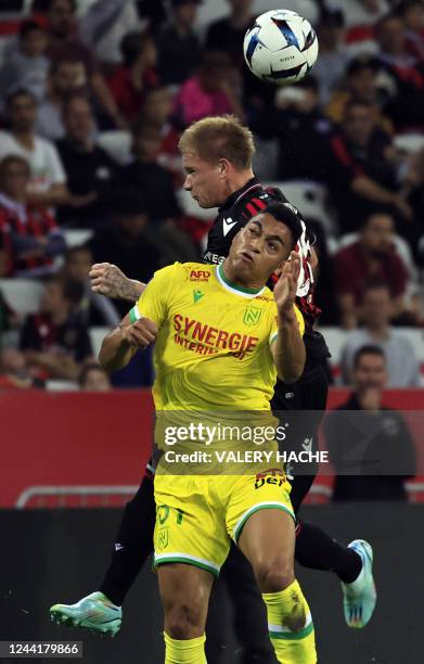 Nantes' Egyptian forward Mostafa Mohamed heads the ball during the French L1 football match between OGC Nice and FC Nantes at the Allianz Riviera...