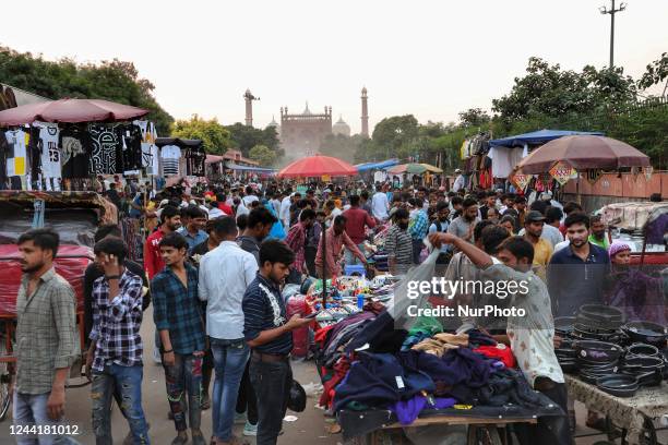 People purchase Clothes and other Essential items from Sunday Market in Old Delhi India on 23 October 2022