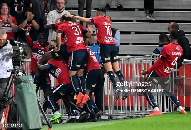 Lille's players celebrate after scoring a goal during the French L1 football match between Lille LOSC and AS Monaco at Stade Pierre-Mauroy in...