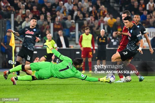 Napoli's Italian goalkeeper Alex Meret dives to deflect a shot during the Italian Serie A football match between AS Rome and Napoli on October 23,...