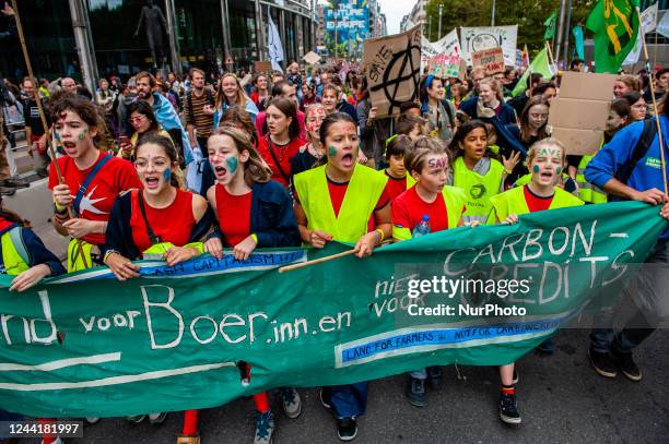 Young people are shouting slogans against capitalism, during a massive climate demonstration organized in Brussels, on October 23rd, 2022.