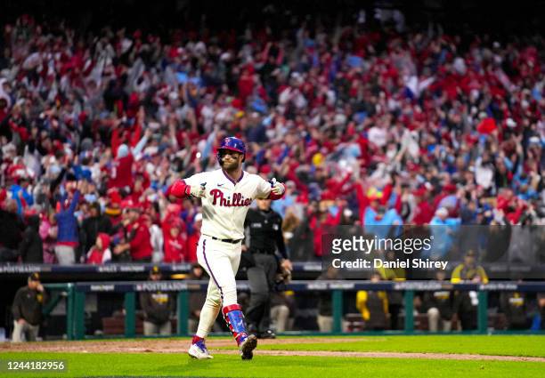 Bryce Harper of the Philadelphia Phillies reacts after hitting a two-run home run in the eighth inning of Game 5 of the NLCS between the San Diego...