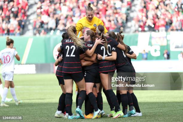 Bella Bixby of Portland Thorns FC jumps up as Portland Thorns players celebrate a goal by Rocky Rodríguez during the first half of the NWSL...