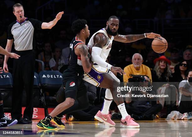 LeBron James of the Los Angeles Lakers backs up against Shaedon Sharpe of the Portland Trail Blazers during the first half at Crypto.com Arena on...