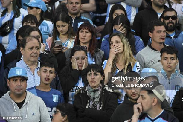 Fans of Racing Club react after losing to River Plate and missing the chance to win the Argentine Professional Football League tournament at the...