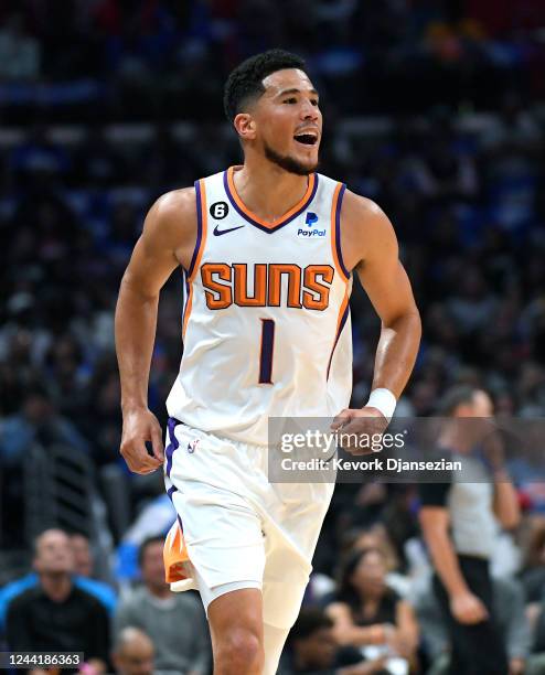 Devin Booker of the Phoenix Suns celebrates after scoring a three point basket against the Los Angeles Clippers during the first half at Crypto.com...