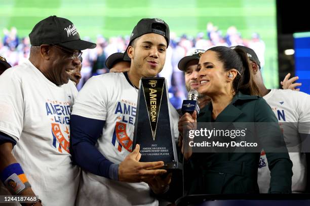 Jeremy Peña of the Houston Astros celebrates with the American League Championship Most Valuable Player trophy on the field after Astros defeated the...