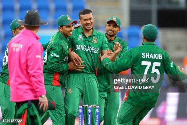 Bangladesh's Taskin Ahmed celebrates the wicket of Netherlands' Colin Ackermann with teammates during the ICC men's Twenty20 World Cup 2022 cricket...