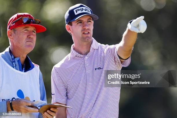 Alex Smalley of the United States talks with caddie Don Donatello at the ninth hole during the first round of The CJ Cup in South Carolina at...