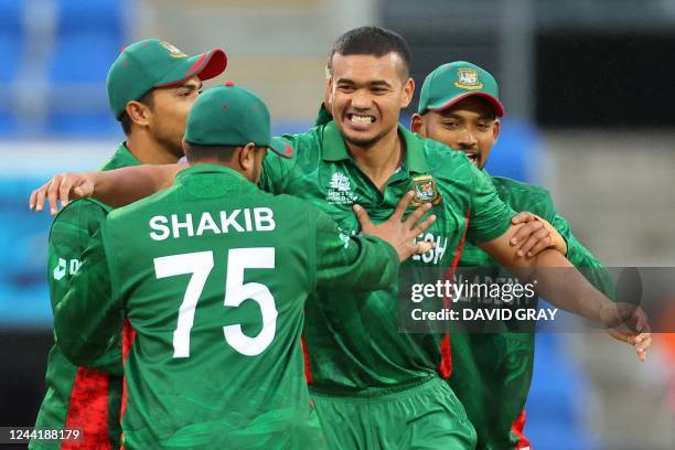 Bangladesh's Taskin Ahmed celebrates the wicket of Netherlands' Colin Ackermann with teammates during the ICC men's Twenty20 World Cup 2022 cricket...