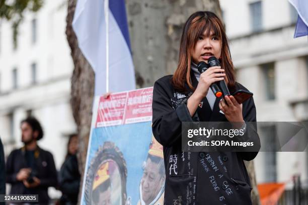 Hong Kong activist, Catherine Li, speaks during an anti-Chinese Communist Party assembly opposite downing street in London. Hundreds of people...