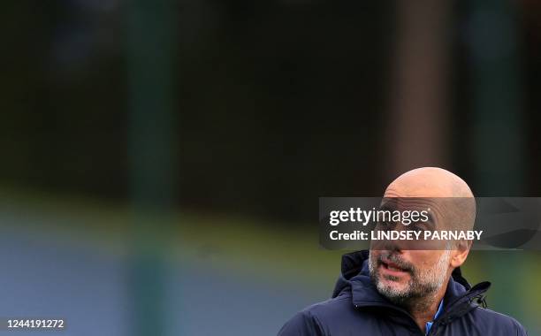 Manchester City's Spanish manager Pep Guardiola takes a team training session at Manchester City training ground in Manchester on October 24 on the...