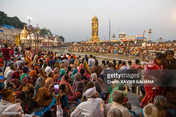 In this picture taken on October 21 Hindu devotees gather for evening prayers at Har Ki Pauri ghat along the banks of the river Ganges in Haridwar.