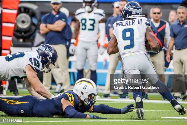Inglewood, CA, Sunday, October 23, 2022 - Los Angeles Chargers linebacker Kyle Van Noy falls short of tackling Seattle Seahawks running back Kenneth...