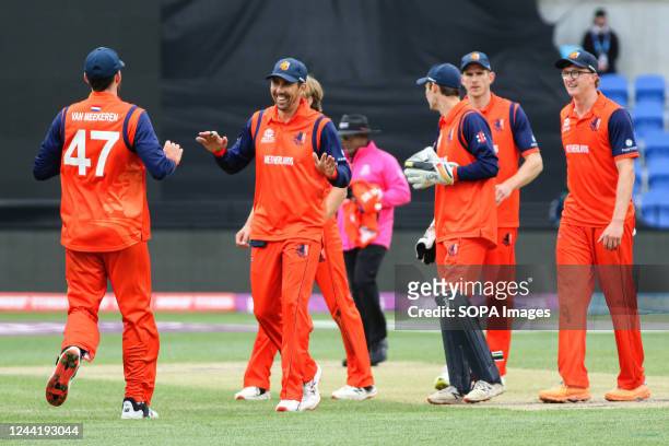 Netherlands cricket players celebrate a wicket during the T20 World Cup cricket match between Netherlands and Bangladesh at Blundstone Arena....