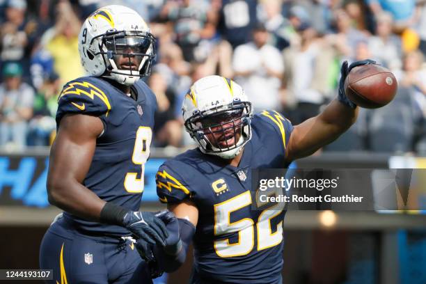 Inglewood, CA, Sunday, October 23, 2022 - Los Angeles Chargers linebacker Khalil Mack celebrates with teammate Kenneth Murray Jr. After recovering a...