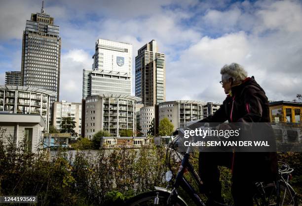 Cyclist rides past the headquarters of Dutch medical and consumer electronics manufacturer Philips in Amsterdam on October 23, 2022. - Dutch medical...