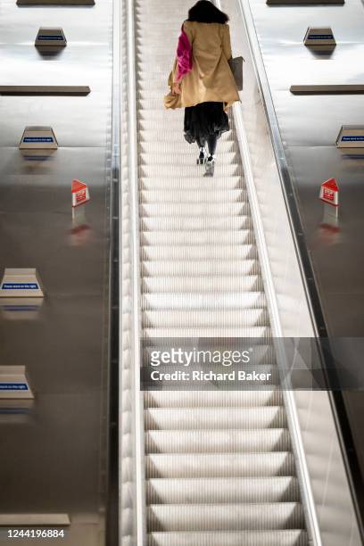 On the day that the Elizabeth's Line newest station opens to the public, passengers ride escalators, on 24th October 2022, in London, England. Bond...