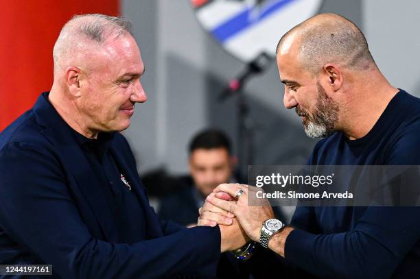 Massimiliano Alvini head coach of Cremonese greets Dejan Stankovic head coach of Sampdoria prior to kick-off in the Serie A match between US...