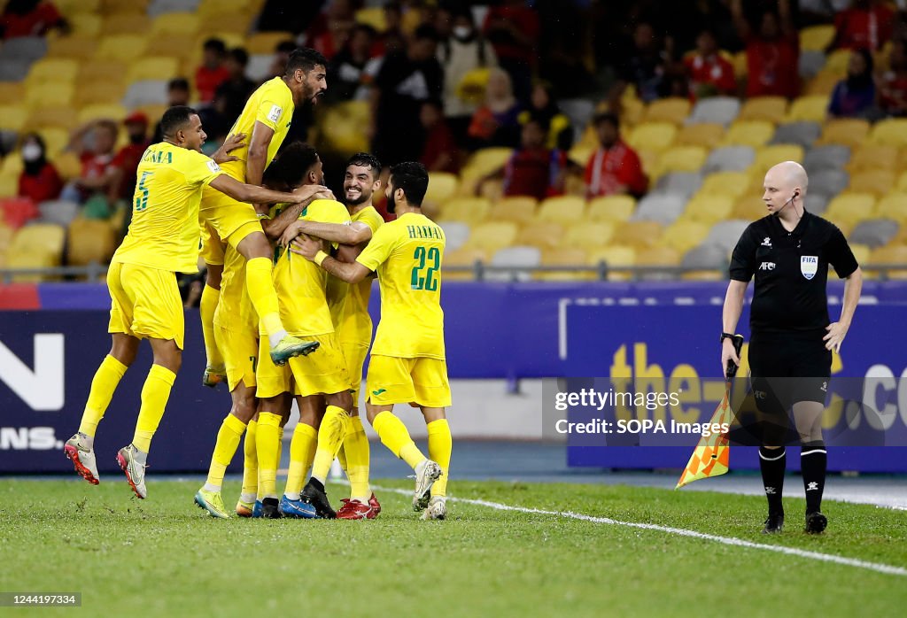 Al Seed Club players celebrate after scoring a goal during...
