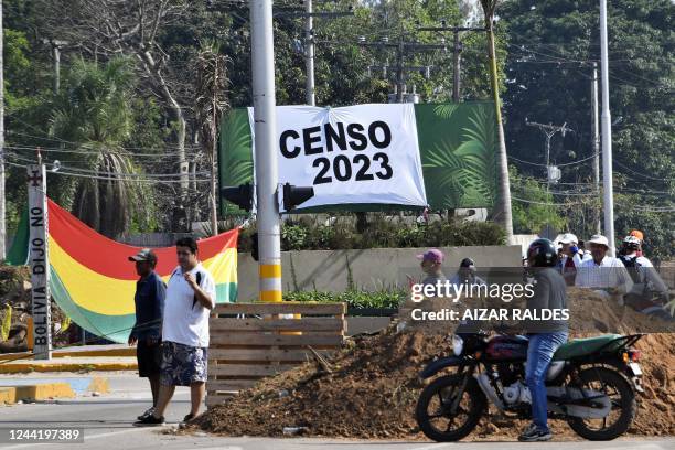 People block a street during an indefinite strike hold by unions opposing the government of Bolivian President Luis Arce to demand a census for 2023,...