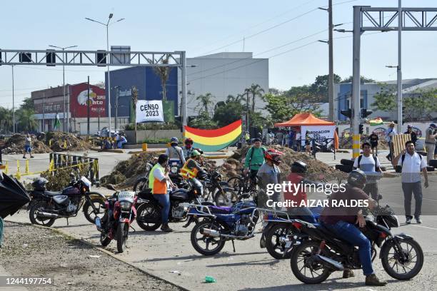 People block a street during an indefinite strike hold by unions opposing the government of Bolivian President Luis Arce to demand a census for 2023,...