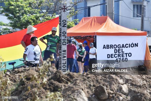 People block a street during an indefinite strike hold by unions opposing the government of Bolivian President Luis Arce to demand a census for 2023,...