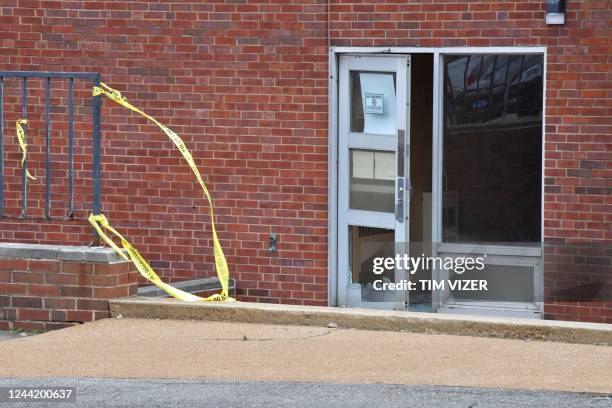 Broken glass in the entrance on the north side of the Central Visual and Performing Arts High School after a shooting that left three people dead...