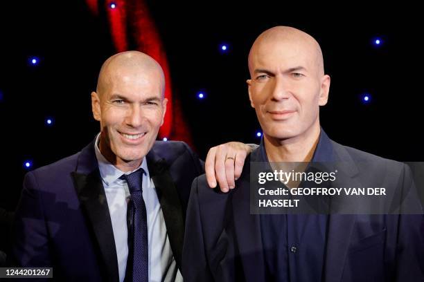 French former forward football player Zinedine Zidane poses next to his new wax statue at the Musee Grevin in Paris, on October 24, 2022.