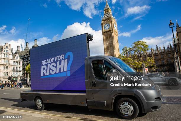Vehicle with a mobile LED screen used by anti-Brexit campaign group Led by Donkeys passes Parliament displaying a message referring to Conservative...