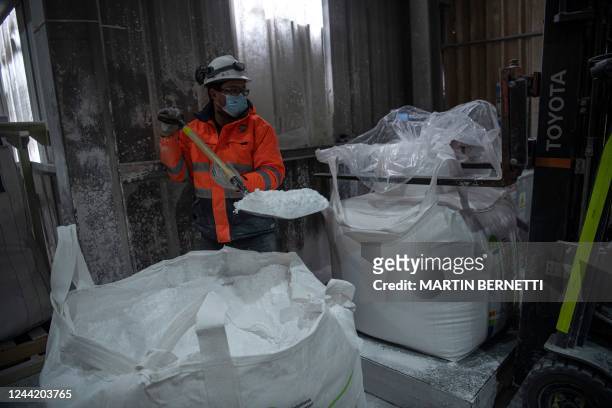 Worker fills 99.9% lithium in 500-kilogram bags inside the El Carmen lithium processing plant of Chile's SQM in Antofagasta, Chile, on September 13,...