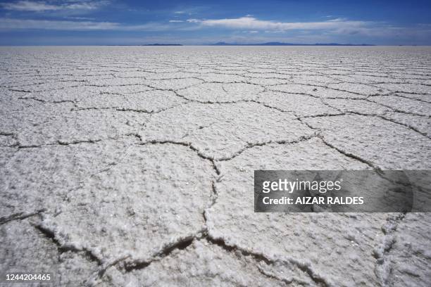View of the Uyuni salt flat in Uyuni, Bolivia, on October 16, 2022. - The turquoise glimmer of open-air pools meets the dazzling white of a seemingly...