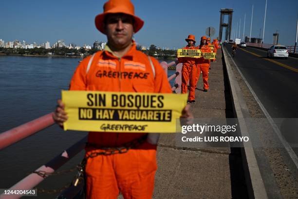 Greenpeace activists protest on the General Manuel Belgrano bridge, which connects the cities of Corrientes and Resistencia, in Argentina, on October...
