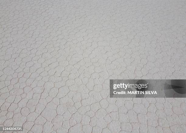 Aerial view showing naturally formed hexagon shapes made of salt crystals at the Salinas Grandes salt flat in the northern province of Jujuy,...