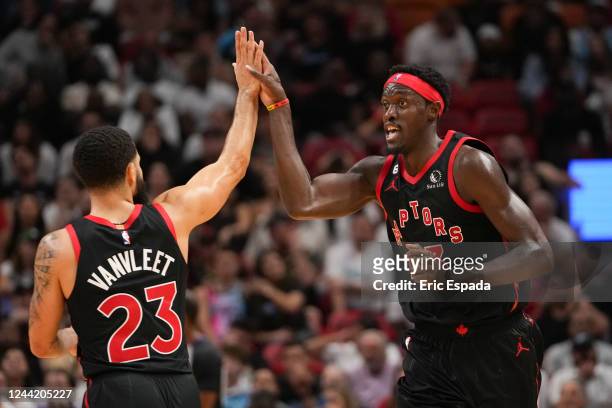 Pascal Siakam of the Toronto Raptors high fives Fred VanVleet after hitting a three point shot in the fourth quarter against the Miami Heat at FTX...