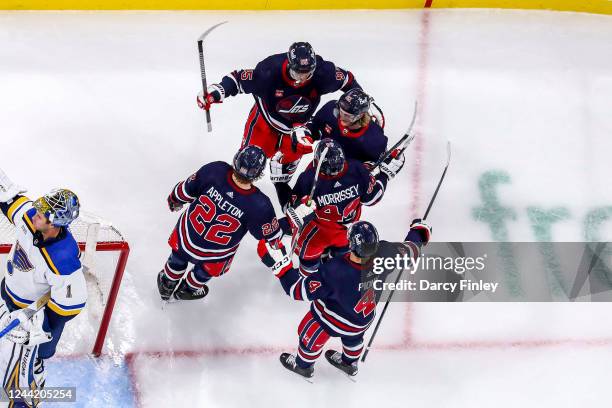 Mark Scheifele, Kyle Connor, Josh Morrissey, Mason Appleton and Neal Pionk of the Winnipeg Jets celebrate a second period goal against the St. Louis...