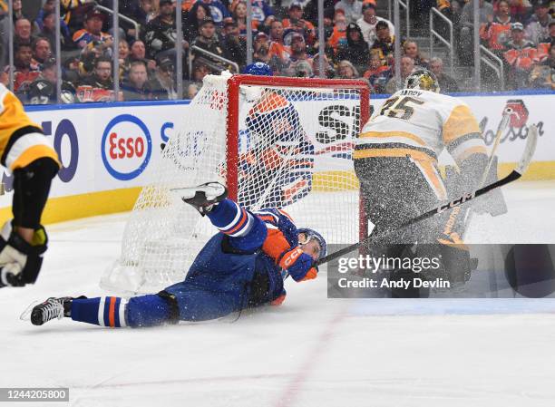 Connor McDavid of the Edmonton Oilers crashes into the net during the game against the Pittsburgh Penguins on October 24, 2022 at Rogers Place in...