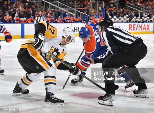 Connor McDavid of the Edmonton Oilers faces off against Sidney Crosby of the Pittsburgh Penguins during the game on October 24, 2022 at Rogers Place...