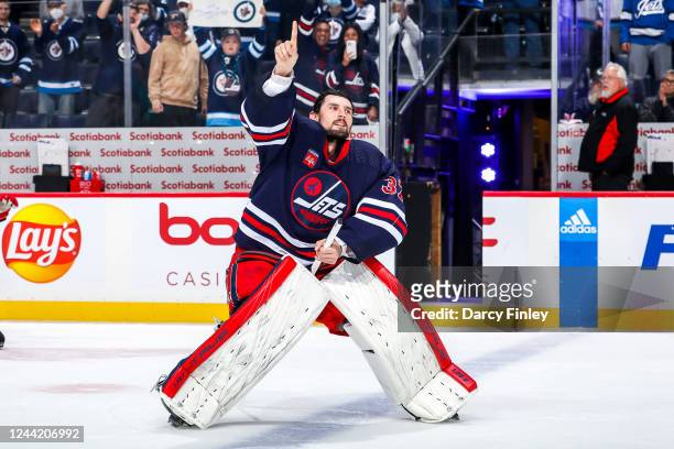 Goaltender Connor Hellebuyck of the Winnipeg Jets celebrates after receiving first star honours following a 4-0 shutout victory over the St. Louis...
