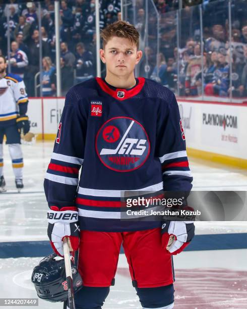 Cole Perfetti of the Winnipeg Jets stands on the ice during the singing of the National anthems prior to puck drop against the St. Louis Blues at the...