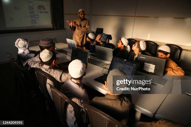 Palestinian students dressed Sharia uniform, attend technology lessons at Al-Taabieen Sharia School in Gaza City on October 24, 2022. There are ten...