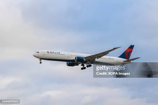 Delta Air Lines wide-body Boeing 767-400 airplane with tail number N836MH landing at London Heathrow Airport in the UK. Delta Airlines is the second...