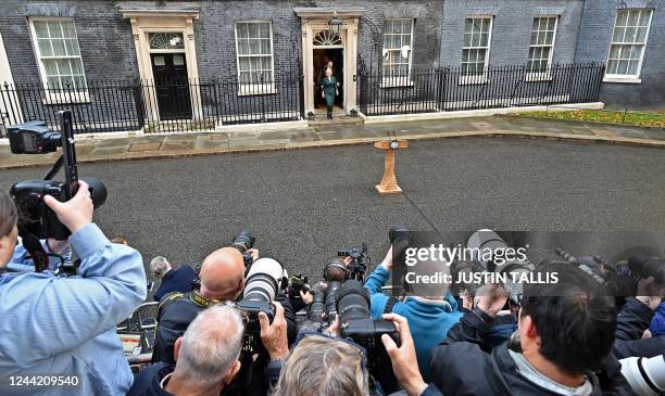 Britain's outgoing Prime Minister Liz Truss arrives to deliver her final speech outside 10 Downing Street in central London, before heading to...