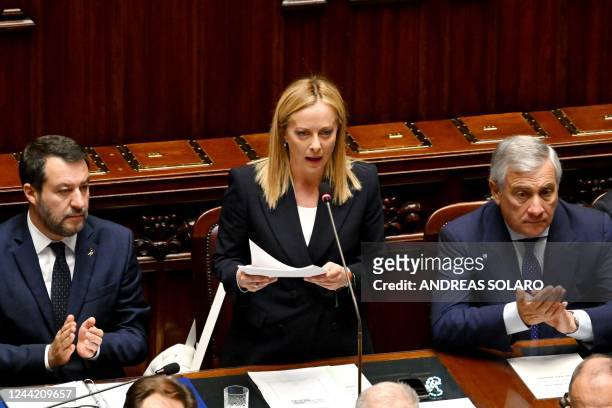 Italys new Prime Minister Giorgia Meloni speaks in her first address to parliament, next to her Deputy and Foreign Minister, Antonio Tajani and her...