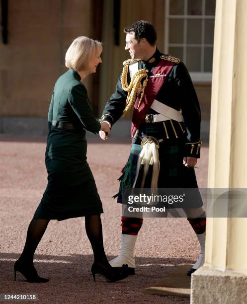 Outgoing Prime Minister Liz Truss arrives at Buckingham Palace for an audience with King Charles III to formally resign as PM on October 25, 2022 in...