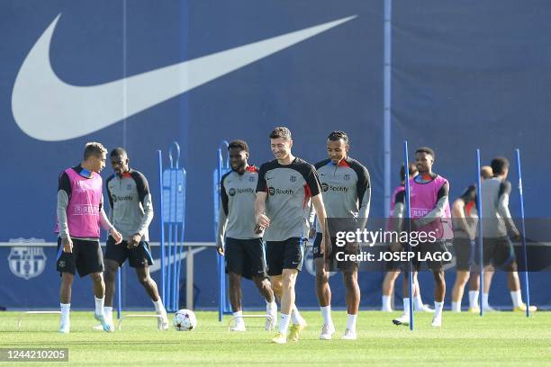 Barcelona's Polish forward Robert Lewandowski and teammates take part in a training session at the Joan Gamper training ground in Sant Joan Despi,...