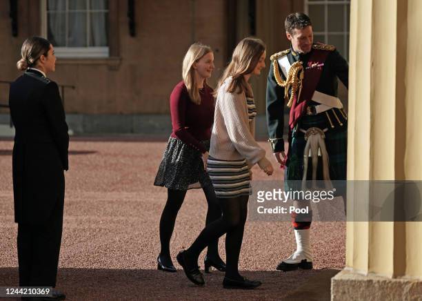 Liz Truss's daughters Liberty and Frances are greeted by King Charles III's equerry Lieutenant Colonel Johnny Thompson, Royal Regiment of Scotland at...